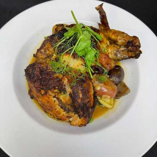 Savory Chicken Under Brick dish served at Palace South Beach