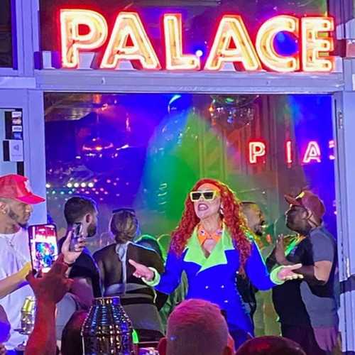 Drag performer Poizon Ivy Lords in the midst of a vibrant performance at Palace South Beach