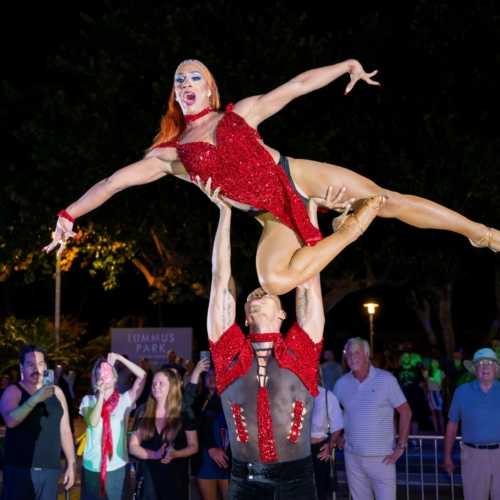 Oscar lifting Tiffany in a stunning aerial pose during their performance at Palace South Beach
