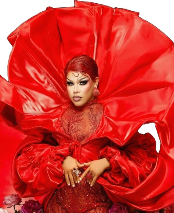 Dayanara in a dramatic sculptural red gown with bold red hair for Palace South Beach in Miami Beach