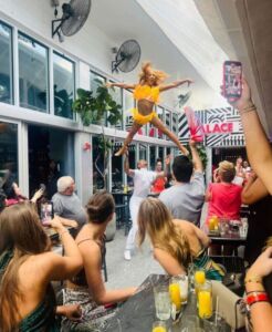 Drag performer entertaining guests during Palace Drag Brunch in Miami