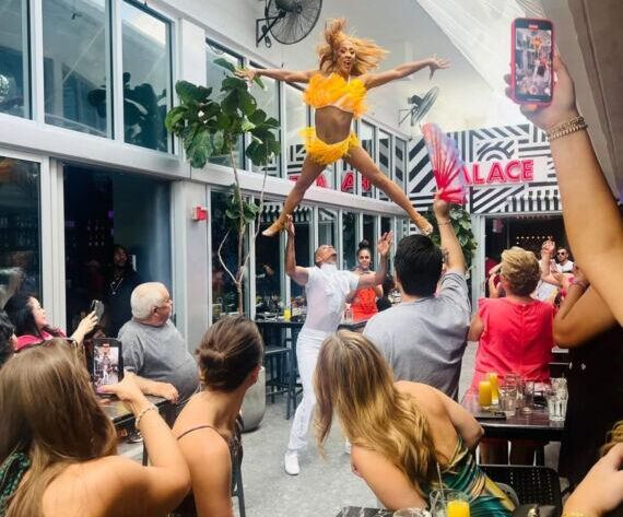 Drag performer entertaining guests during Palace Drag Brunch in Miami
