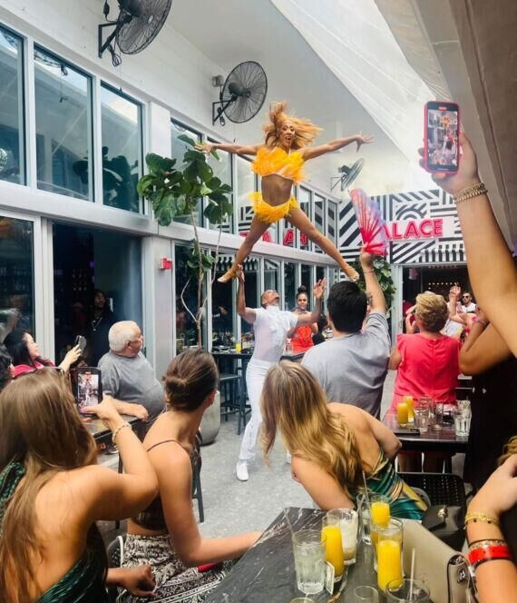 Drag performer entertaining guests during Palace Drag Brunch in Miami
