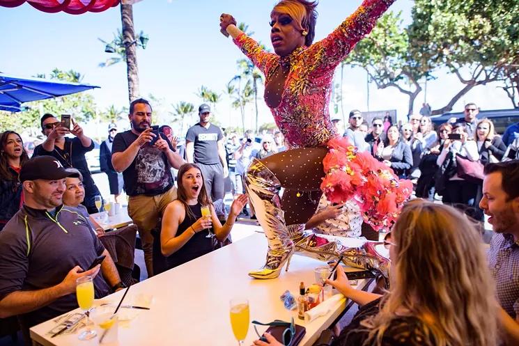 Drag performers entertaining guests at Palace Drag Brunch in Miami