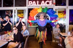 Palace drag queen performing for guests during a Miami drag brunch